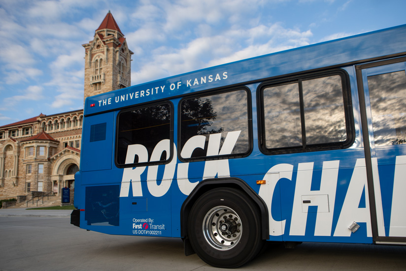 KU bus in front of Dyche Hall on Jayhawk Boulevard